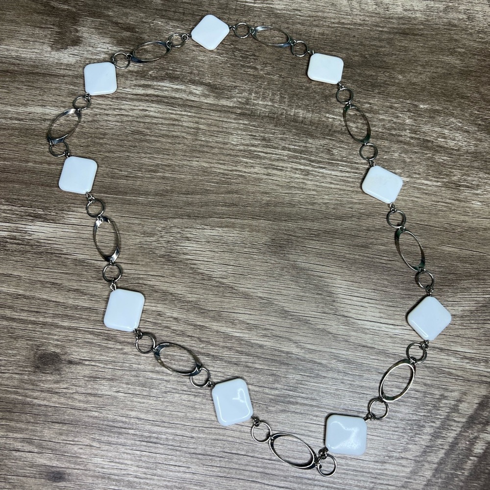 White bead and metal necklace.